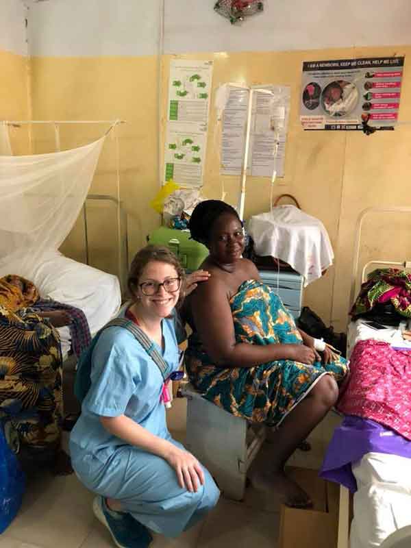 Nicole Capdevila smiling with the woman she helped through labor